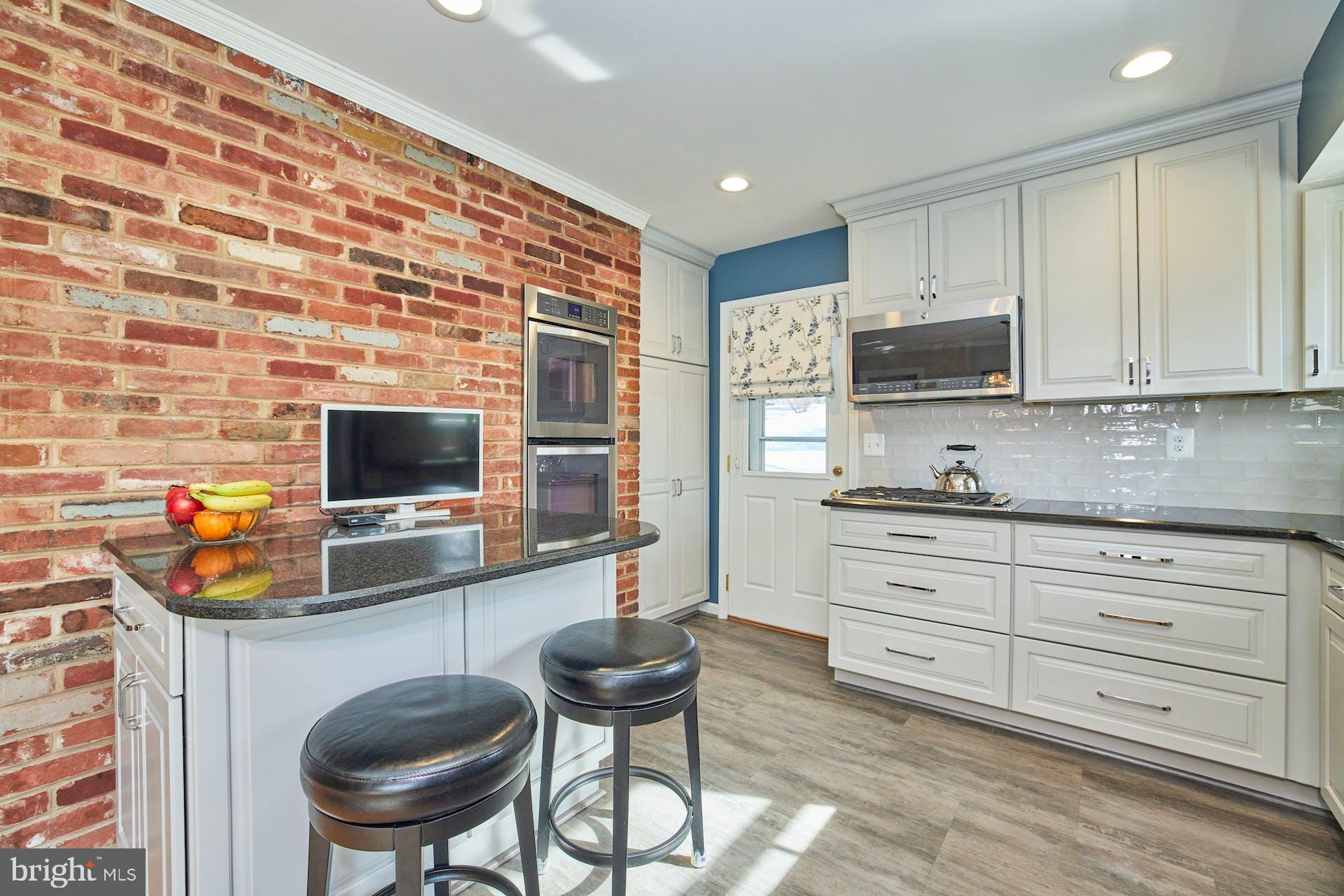 7613 Hamlet Street Springfield, VA 22151 - Photo 11 of 49 Gas cooktop and built-in microwave