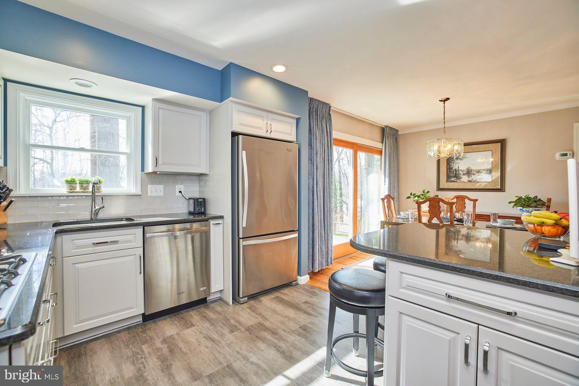 7613 Hamlet Street Springfield, VA 22151 - Photo 13 of 49 Light gray cabinets and granite countertops