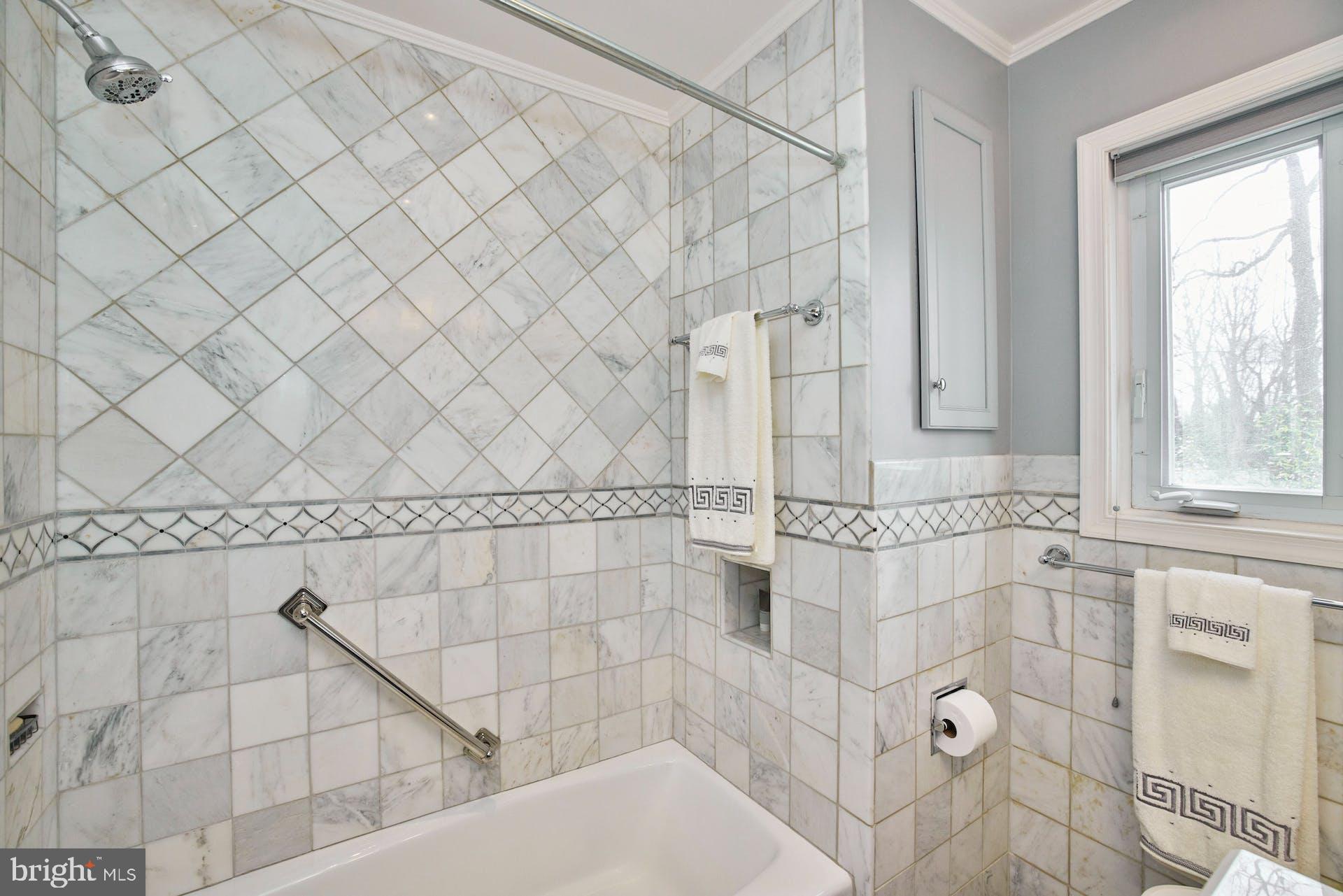 7613 Hamlet Street Springfield, VA 22151 - Photo 21 of 49 Updated bathroom with decorative tile