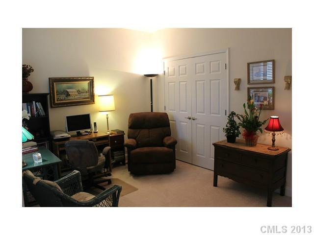 332 Garnet Court, Unit 528 Fort Mill, SC 29708 - Photo 14 of 16 a living room with furniture and a flat screen tv