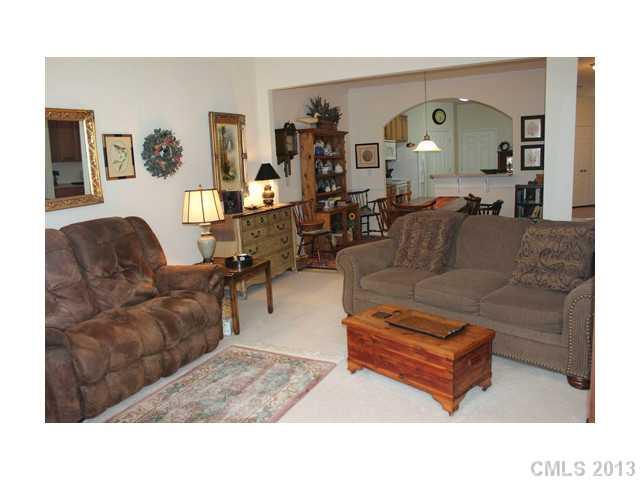 332 Garnet Court, Unit 528 Fort Mill, SC 29708 - Photo 7 of 16 a living room with furniture and wooden floor