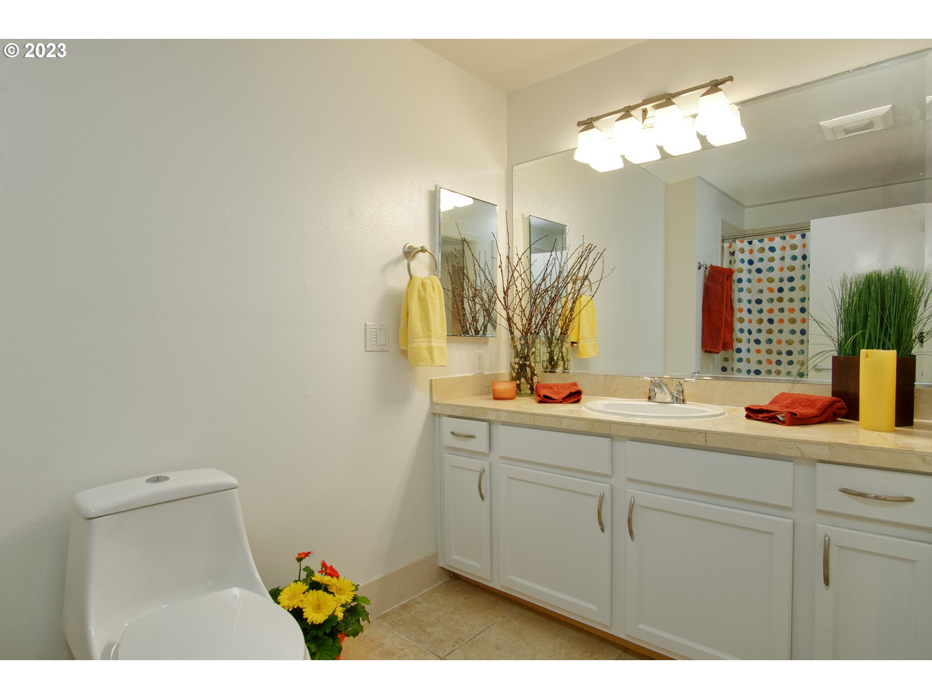1500 Southwest Park Avenue, Unit 118 Portland, OR 97201 - Photo 11 of 30 a bathroom with a sink a mirror and a light fixture
