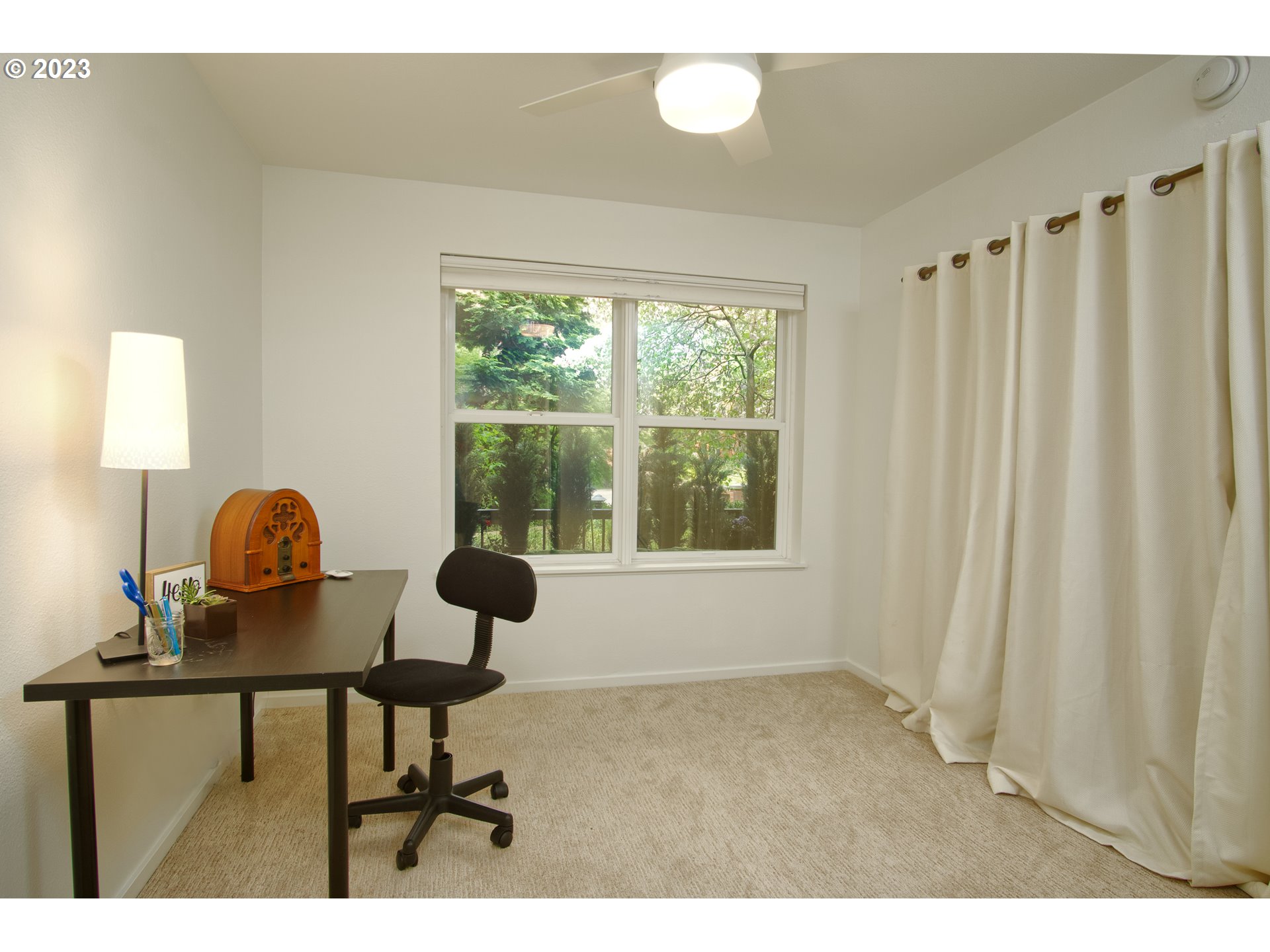 1500 Southwest Park Avenue, Unit 118 Portland, OR 97201 - Photo 13 of 30 a living room with furniture and a window
