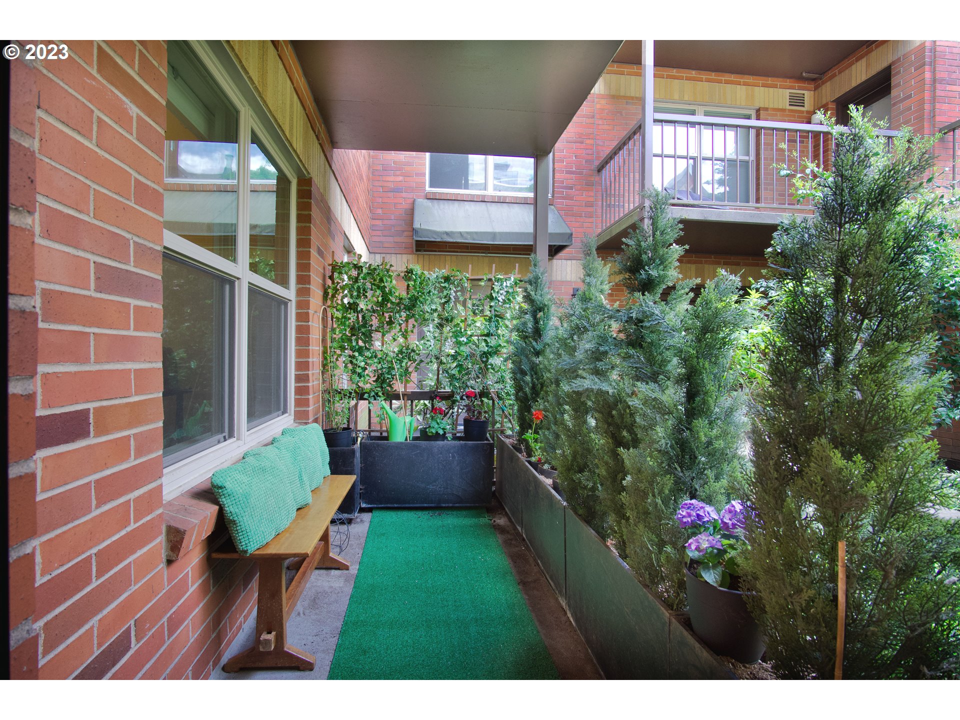 1500 Southwest Park Avenue, Unit 118 Portland, OR 97201 - Photo 14 of 30 a view of a backyard with plants