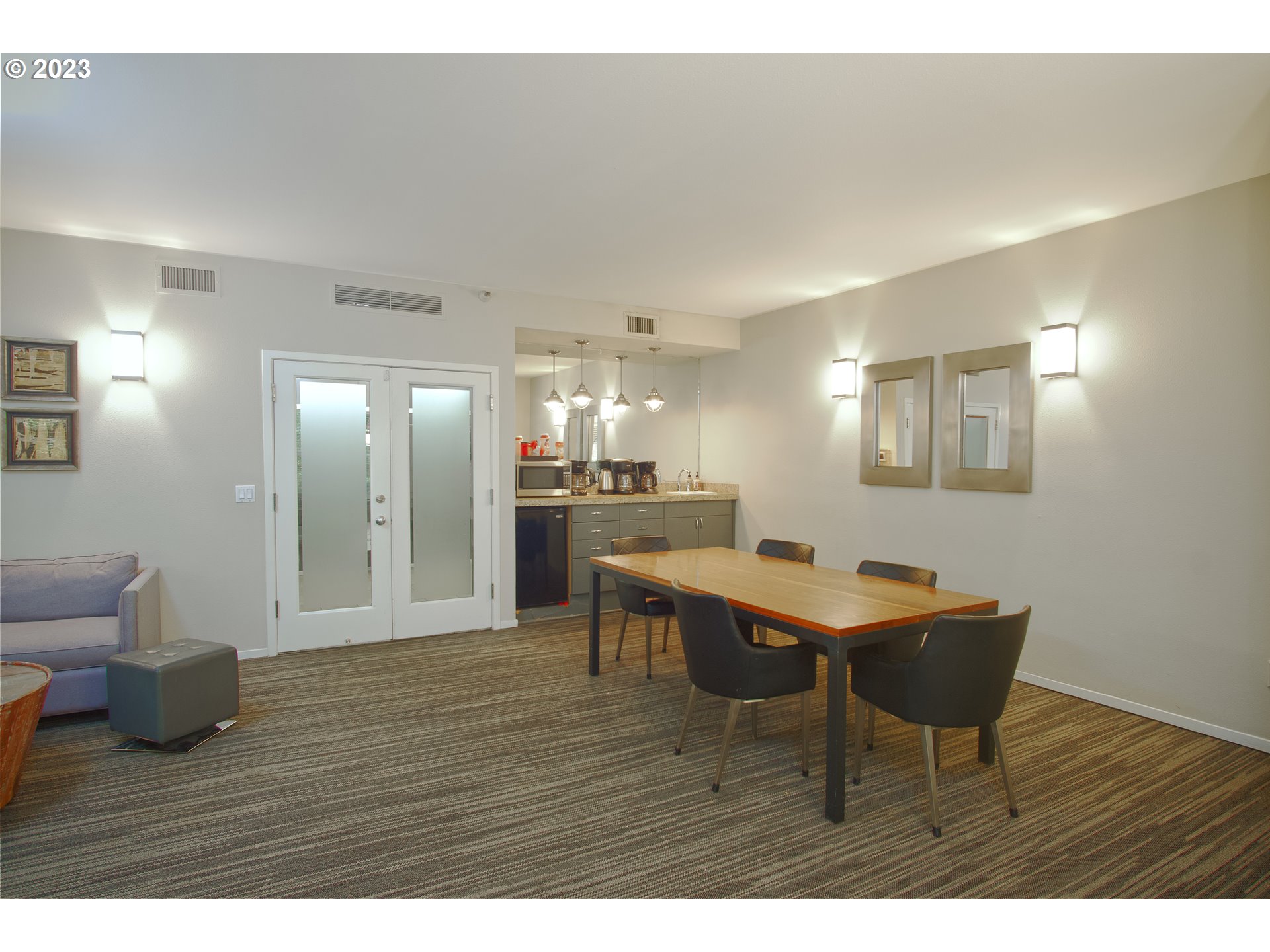 1500 Southwest Park Avenue, Unit 118 Portland, OR 97201 - Photo 19 of 30 a view of a dining room with furniture and wooden floor