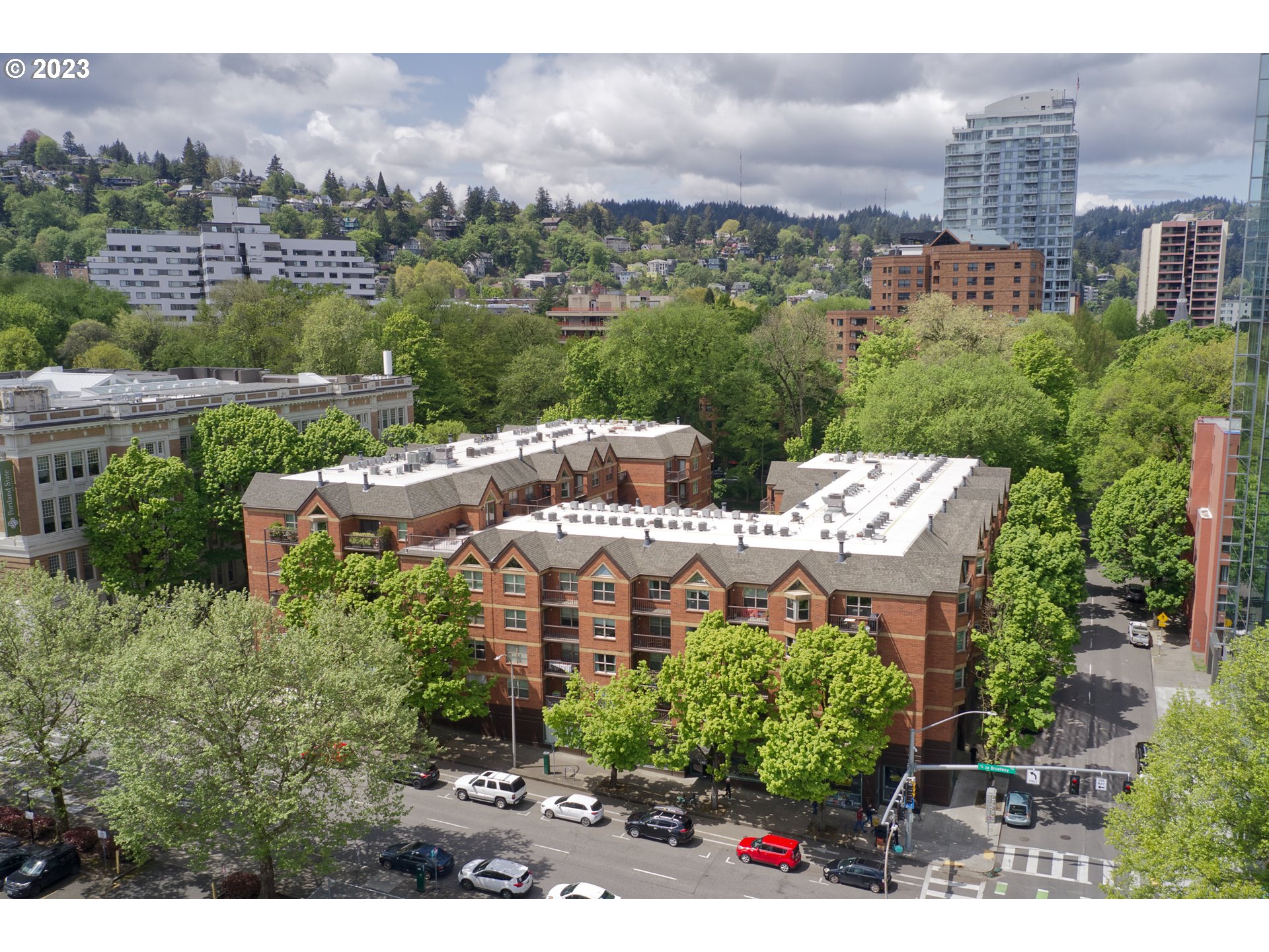 1500 Southwest Park Avenue, Unit 118 Portland, OR 97201 - Photo 2 of 30 an aerial view of a house with a yard and lake view