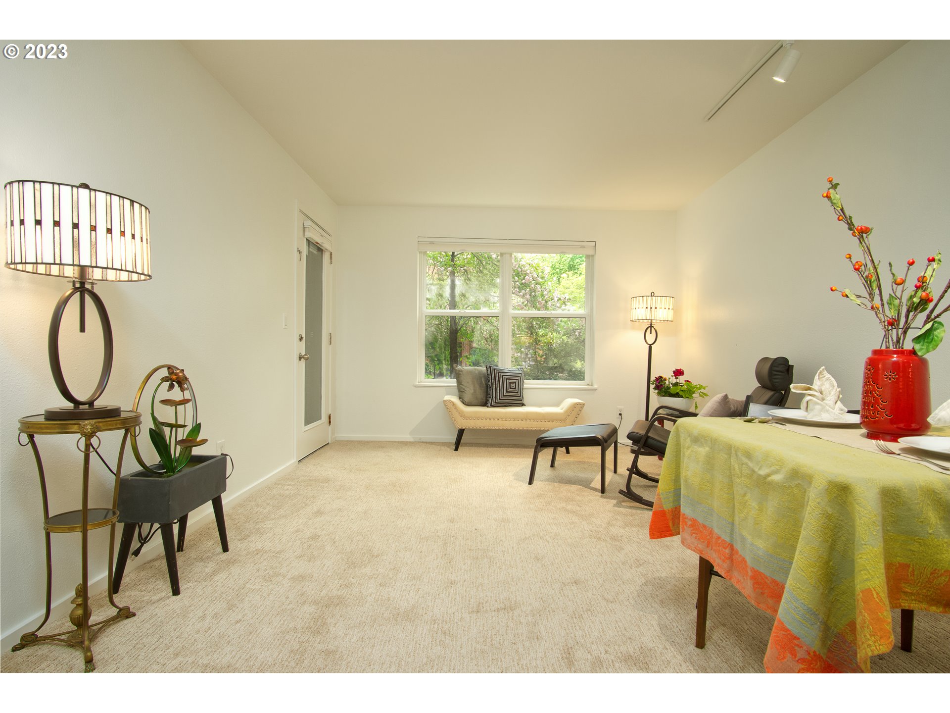 1500 Southwest Park Avenue, Unit 118 Portland, OR 97201 - Photo 4 of 30 a living room with furniture and a window
