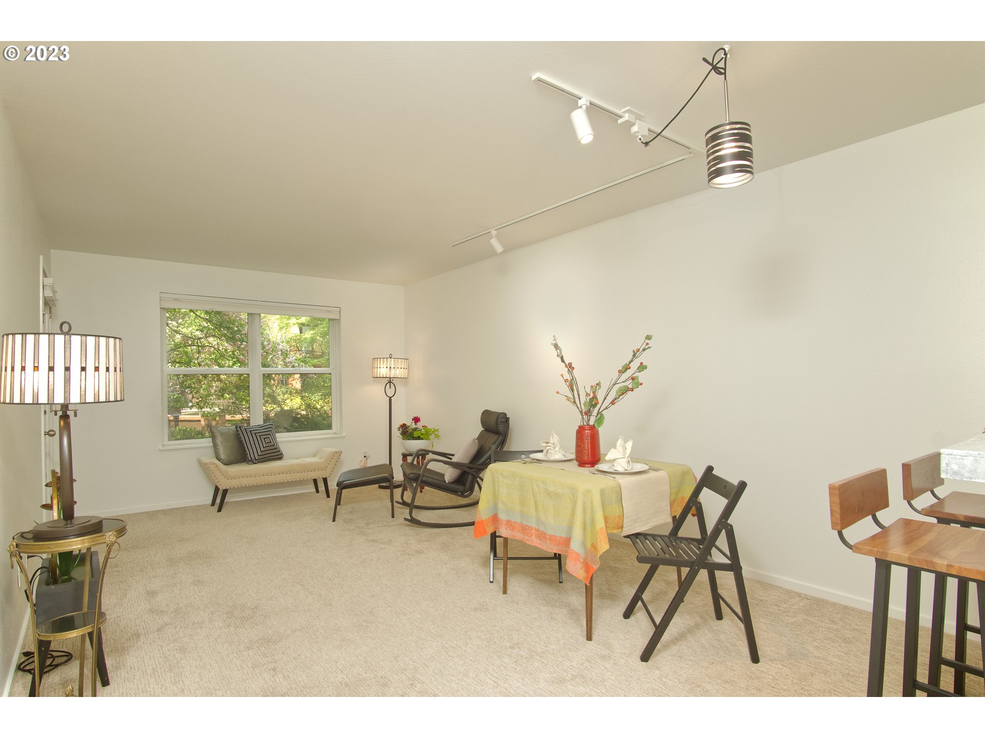1500 Southwest Park Avenue, Unit 118 Portland, OR 97201 - Photo 5 of 30 a living room with furniture and a large window