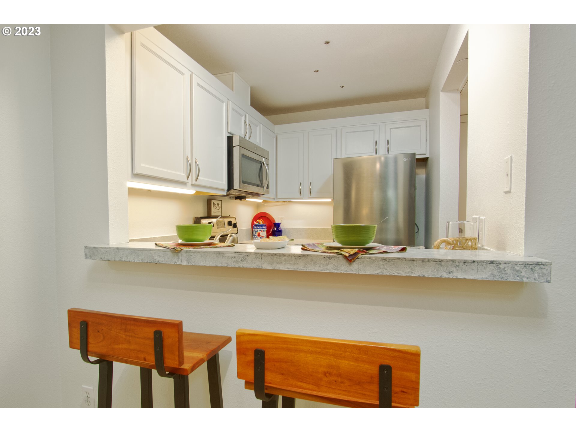 1500 Southwest Park Avenue, Unit 118 Portland, OR 97201 - Photo 6 of 30 a view of a kitchen with stainless steel appliances granite countertop a sink and cabinets