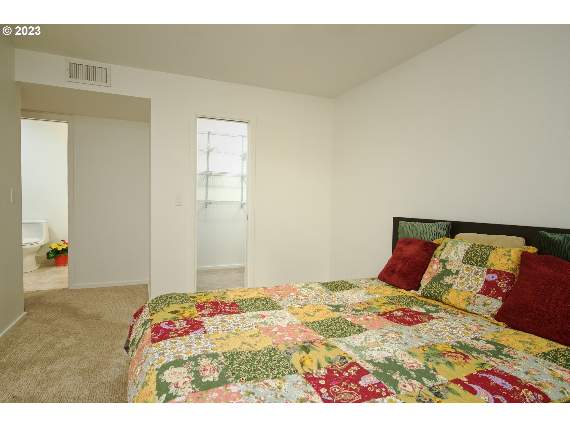 1500 Southwest Park Avenue, Unit 118 Portland, OR 97201 - Photo 10 of 30 a bedroom with a bed and a painting on the wall