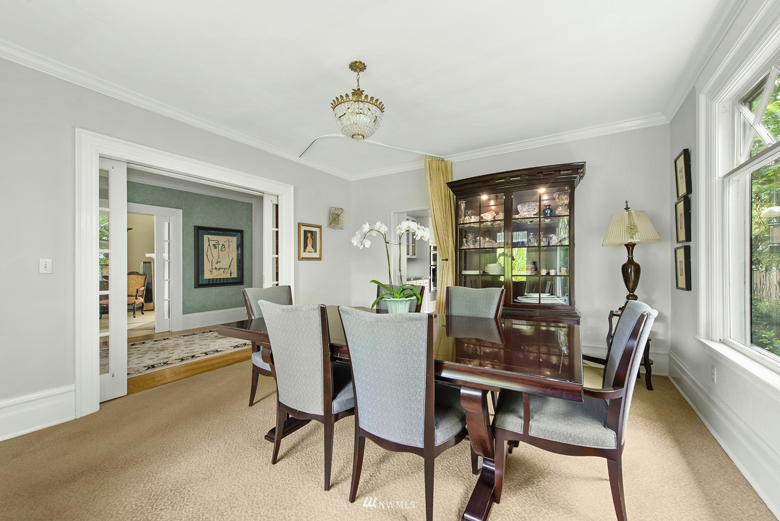 945 17th Avenue East Seattle, WA 98112 - Photo 11 of 40 a view of a dining room with furniture window and wooden floor