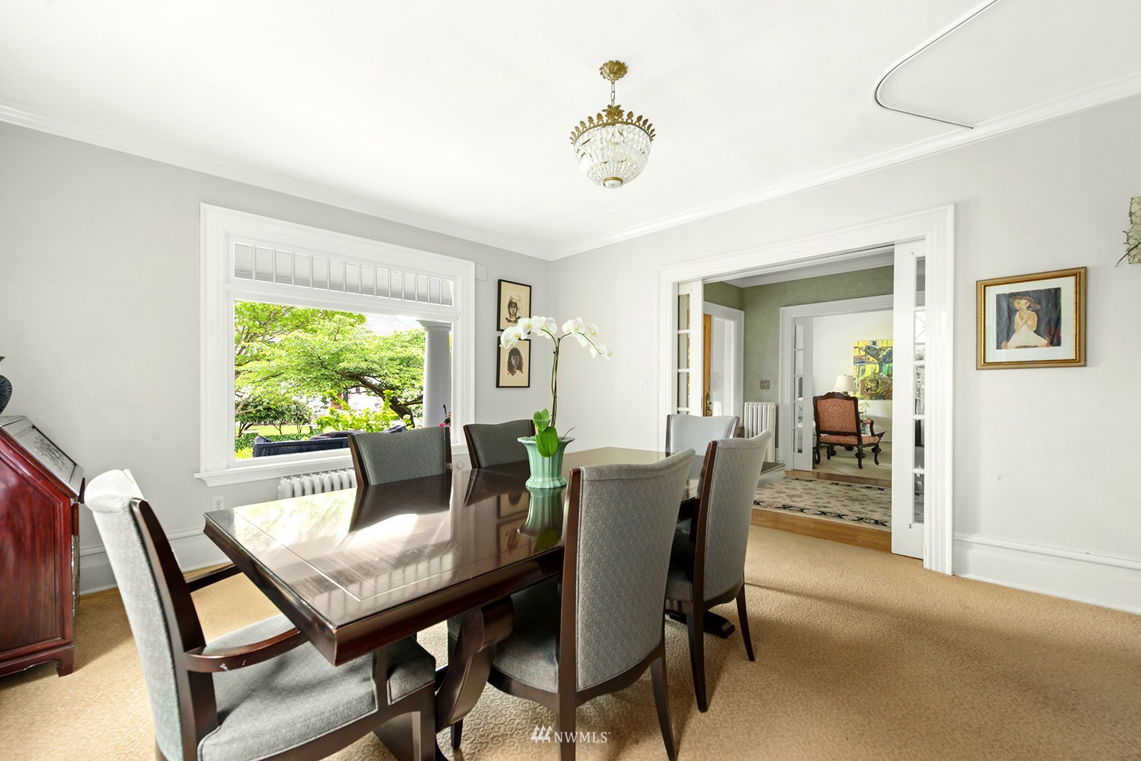 945 17th Avenue East Seattle, WA 98112 - Photo 12 of 40 a view of a dining room with furniture window and outside view