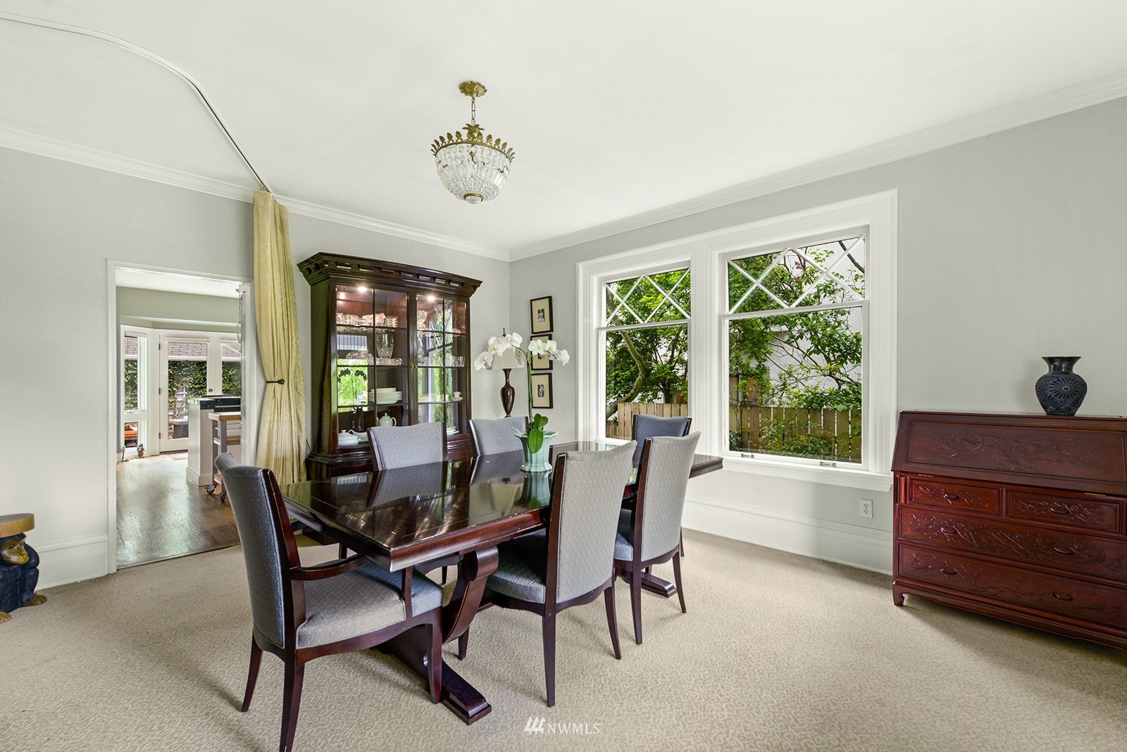 945 17th Avenue East Seattle, WA 98112 - Photo 13 of 40 a view of a dining room with furniture window and outside view