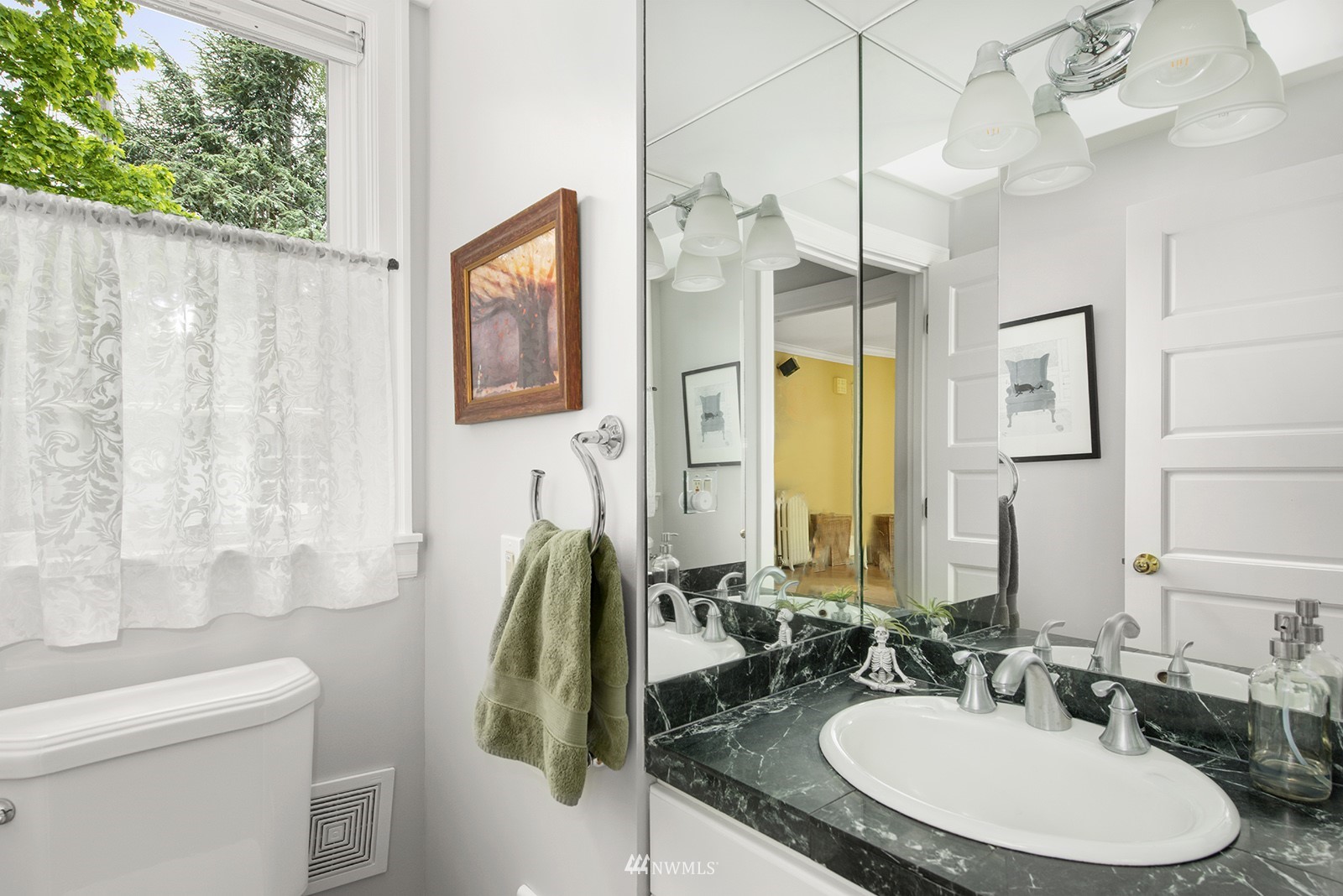 945 17th Avenue East Seattle, WA 98112 - Photo 21 of 40 a bathroom with a granite countertop sink and a mirror