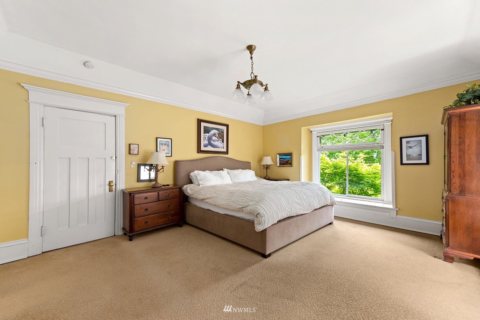 945 17th Avenue East Seattle, WA 98112 - Photo 24 of 40 a bedroom with a large bed and a window
