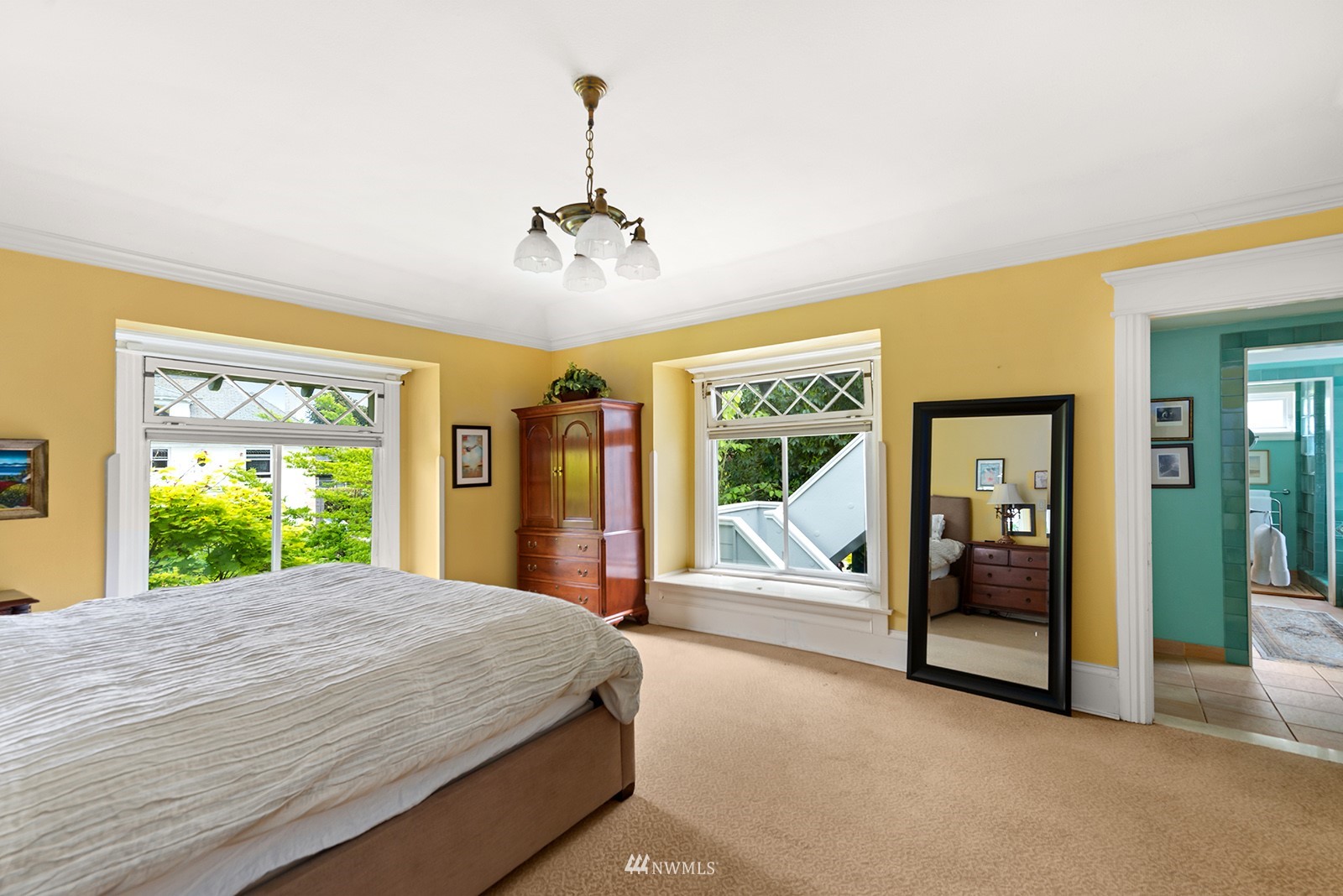 945 17th Avenue East Seattle, WA 98112 - Photo 25 of 40 a bedroom with a large bed and a large window