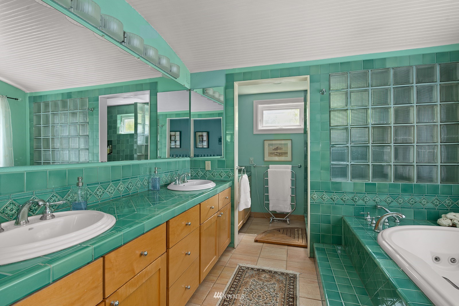 945 17th Avenue East Seattle, WA 98112 - Photo 26 of 40 a bathroom with a granite countertop sink and a mirror