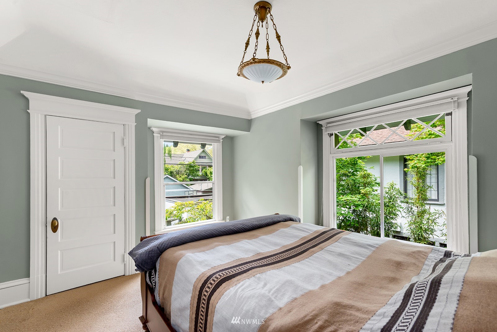 945 17th Avenue East Seattle, WA 98112 - Photo 29 of 40 a bedroom with a bed and a window