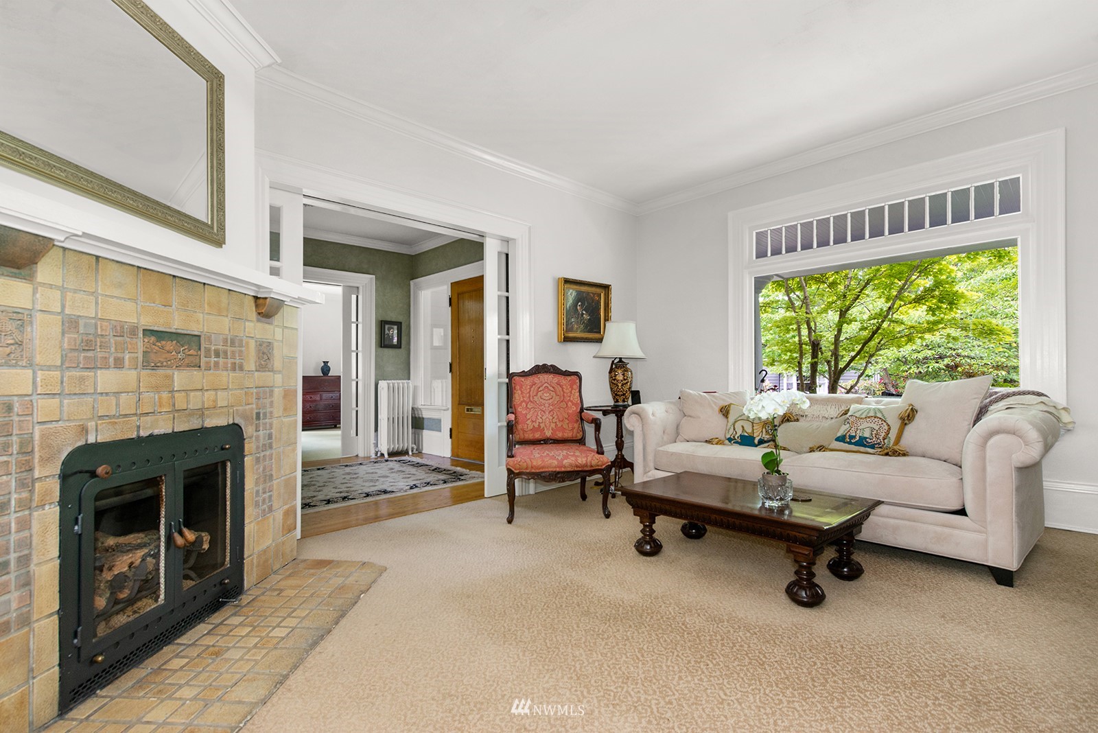 945 17th Avenue East Seattle, WA 98112 - Photo 10 of 40 a living room with furniture and a fireplace