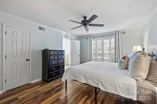 a spacious bathroom with double vanity and a shower