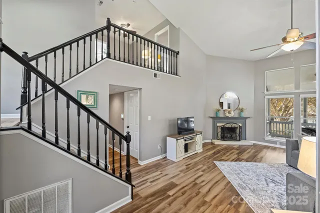 a view of entryway livingroom and hall with wooden floor
