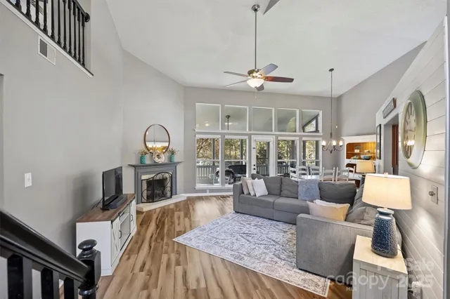 a living room with furniture fireplace and a flat screen tv