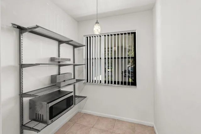 a view of an empty room with a fireplace