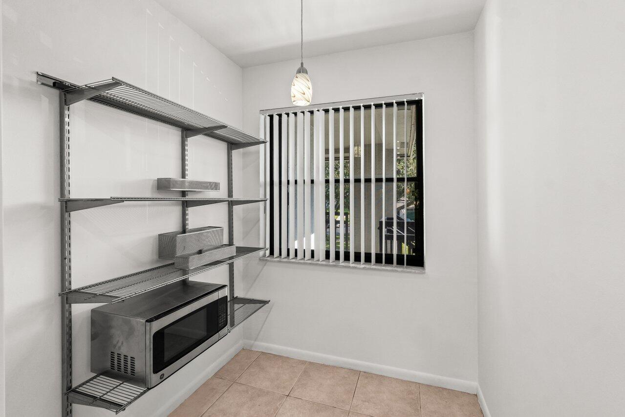 3014 Southwest 21st Terrace, Unit 352B Delray Beach, FL 33445 - Photo 14 of 26 a view of an empty room with a fireplace