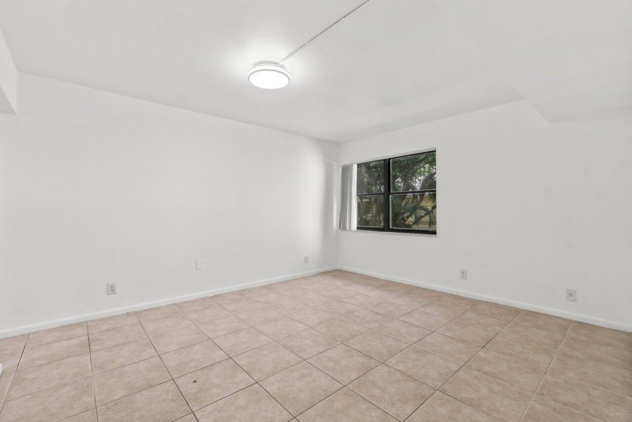 3014 Southwest 21st Terrace, Unit 352B Delray Beach, FL 33445 - Photo 15 of 26 an empty room with windows