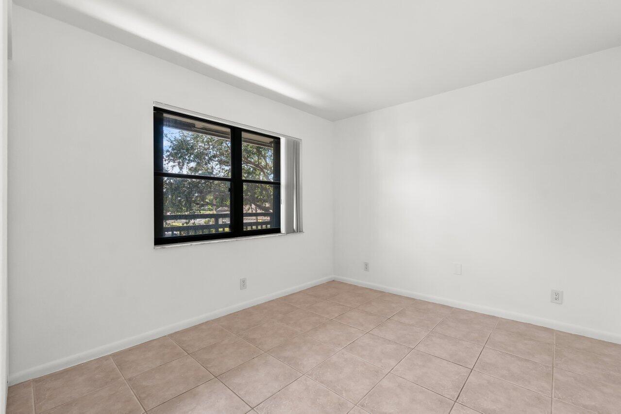 3014 Southwest 21st Terrace, Unit 352B Delray Beach, FL 33445 - Photo 20 of 26 an empty room with windows