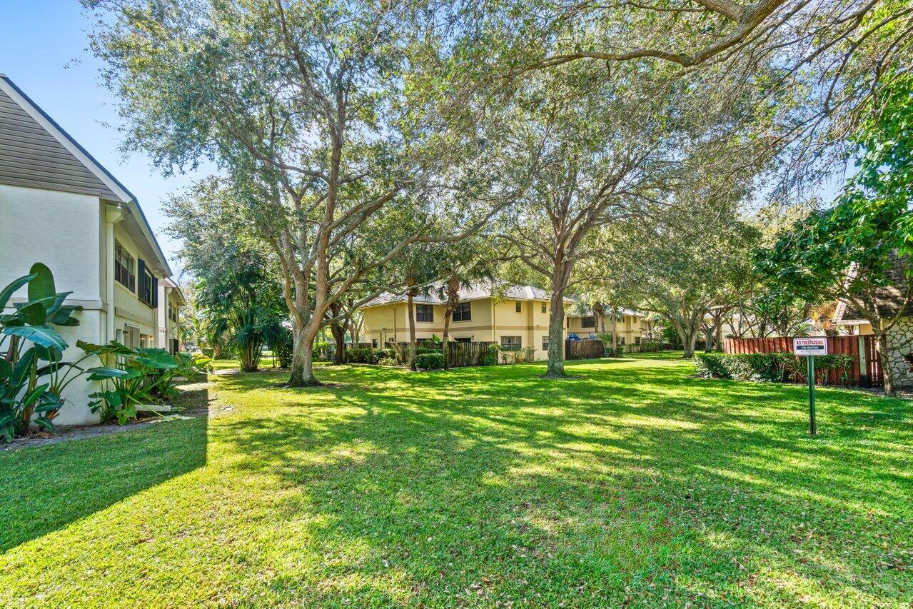 3014 Southwest 21st Terrace, Unit 352B Delray Beach, FL 33445 - Photo 26 of 26 a front view of a house with a yard