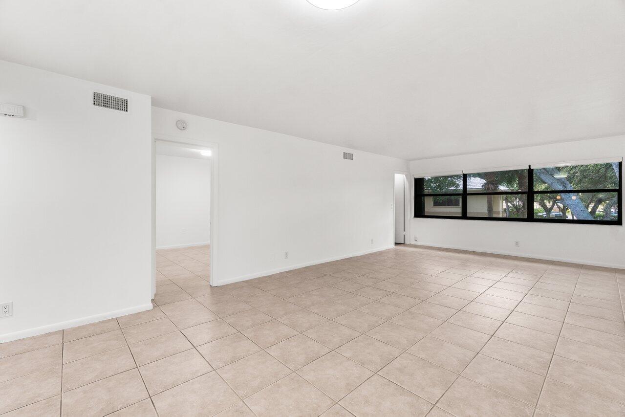 3014 Southwest 21st Terrace, Unit 352B Delray Beach, FL 33445 - Photo 8 of 26 a view of an empty room with a window