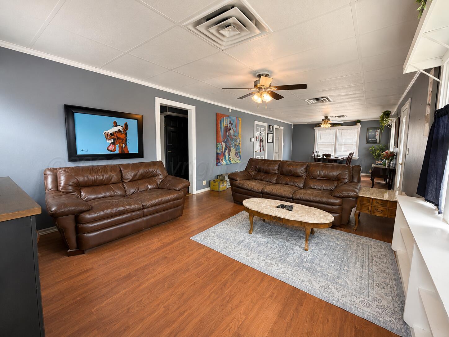 606 South Prospect Street Amarillo, TX 79106 - Photo 10 of 22 a living room with furniture and a wooden floor