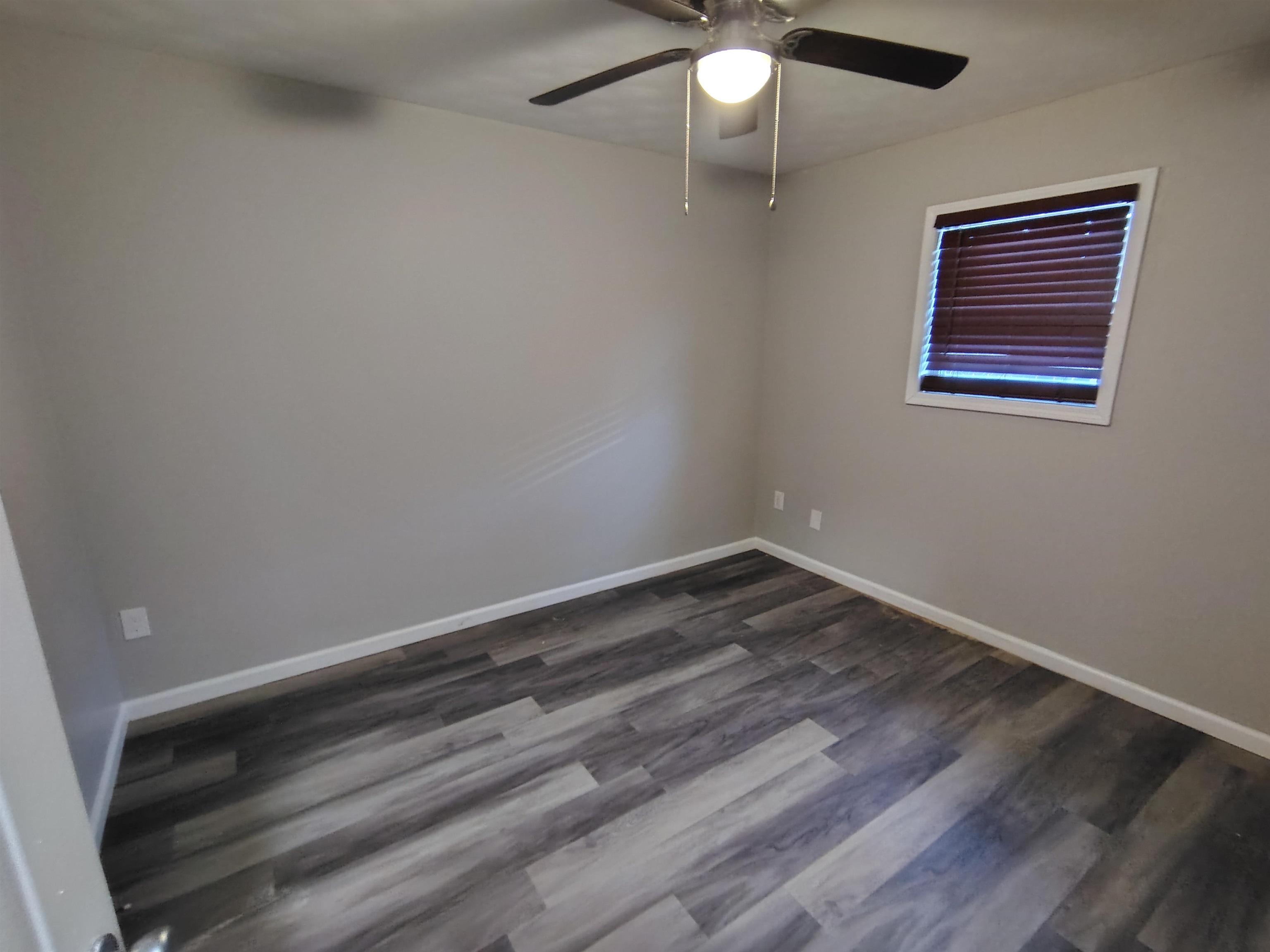 802 Pendleton Street Memphis, TN 38114 - Photo 4 of 10 wooden floor in an empty room