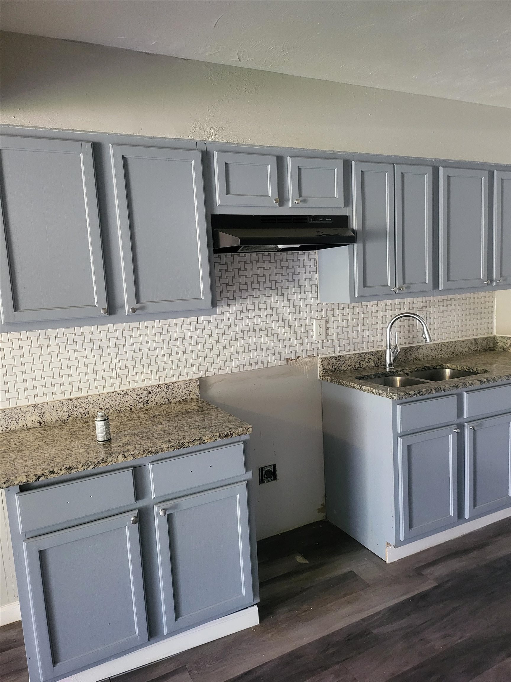 802 Pendleton Street Memphis, TN 38114 - Photo 7 of 10 a kitchen with granite countertop cabinets stainless steel appliances and a sink