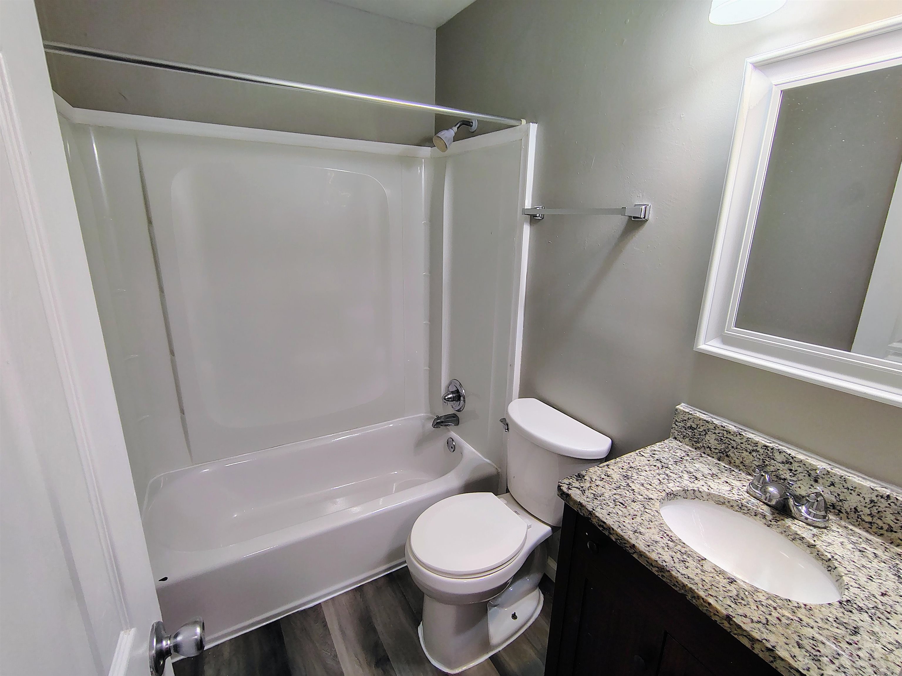 802 Pendleton Street Memphis, TN 38114 - Photo 8 of 10 a bathroom with a granite countertop sink toilet and shower