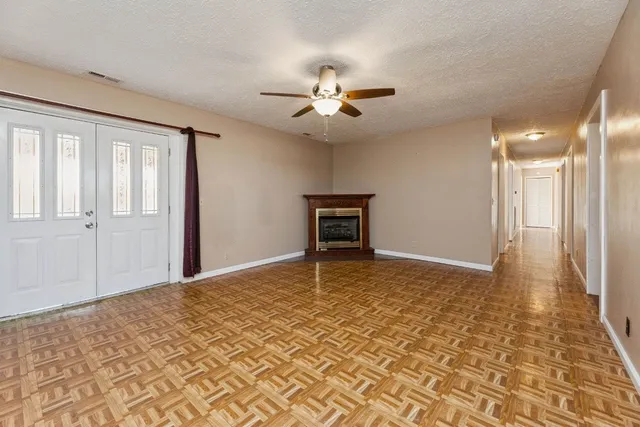 a view of a livingroom with a ceiling fan