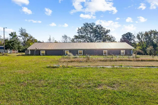 a view of a house with a big yard