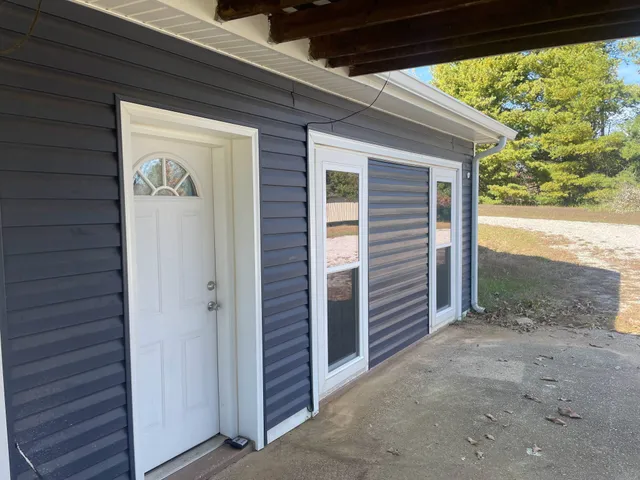 a view of front door and wooden floor