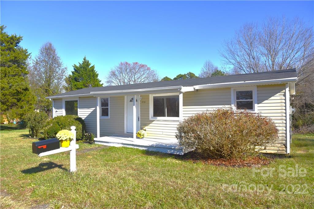 458 Kimmon Road Harmony, NC 28634 - Photo 1 of 23 a house view with a seating space and garden view