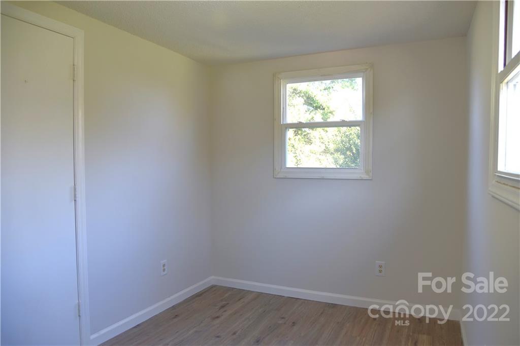 458 Kimmon Road Harmony, NC 28634 - Photo 11 of 23 an empty room with a window