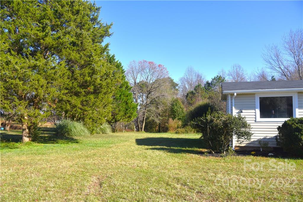 458 Kimmon Road Harmony, NC 28634 - Photo 16 of 23 a view of a house with backyard and trees