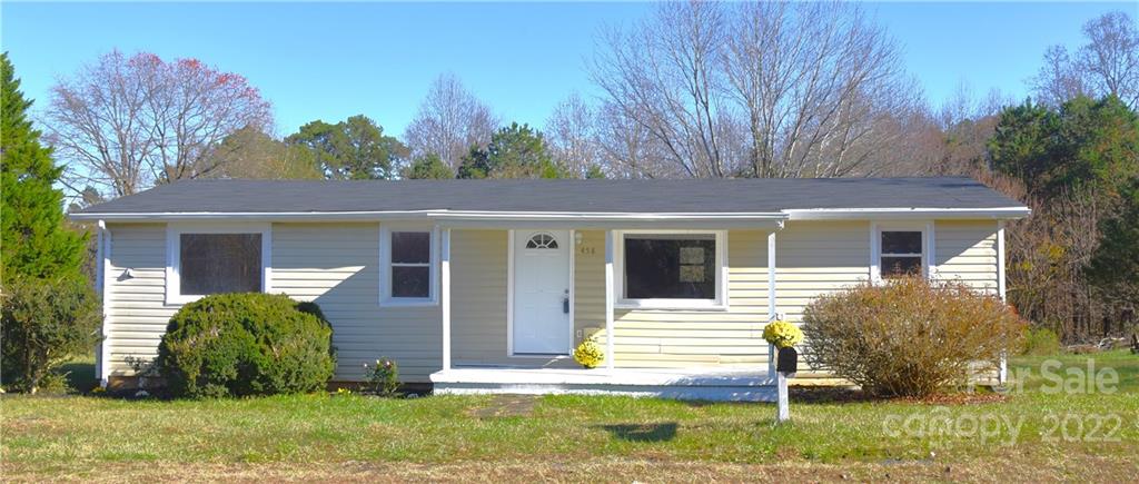 458 Kimmon Road Harmony, NC 28634 - Photo 2 of 23 a view of a house with a yard and plants