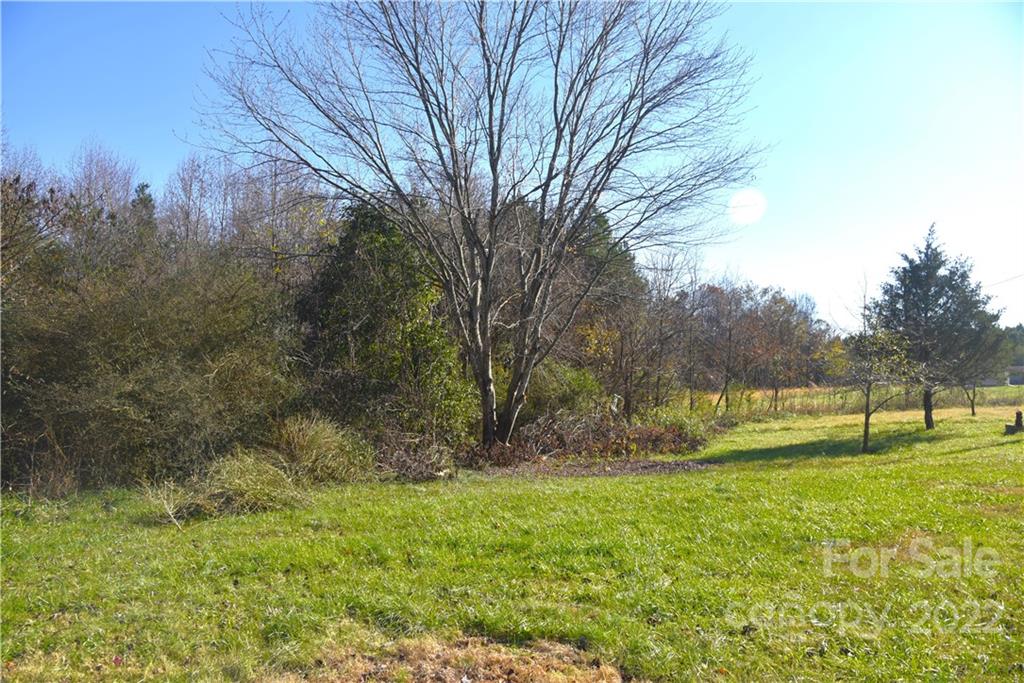 458 Kimmon Road Harmony, NC 28634 - Photo 22 of 23 a view of outdoor space with garden and trees