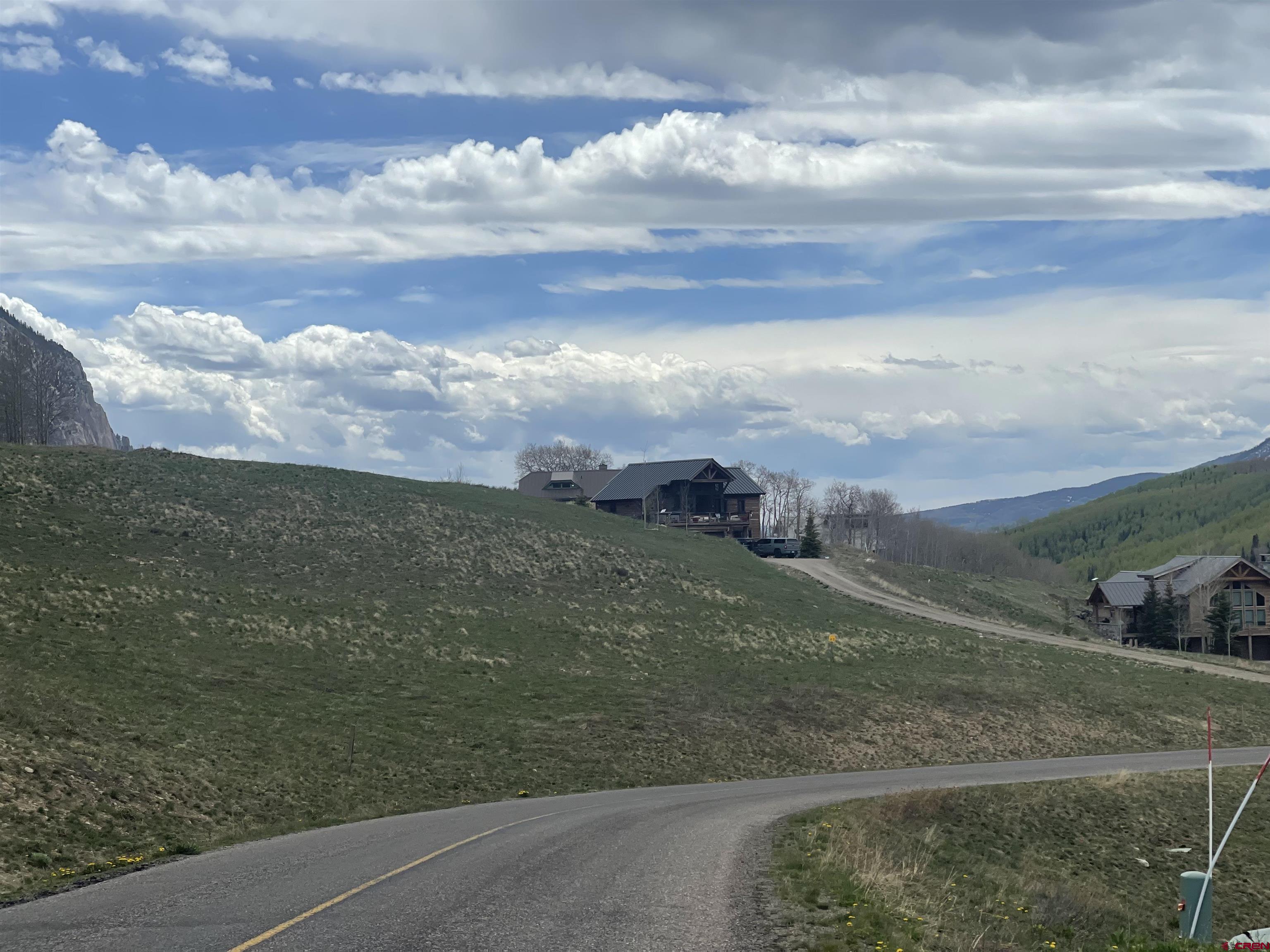116 Meadow Drive Crested Butte, CO 81224 - Photo 13 of 20 a view of a field with an trees in the background