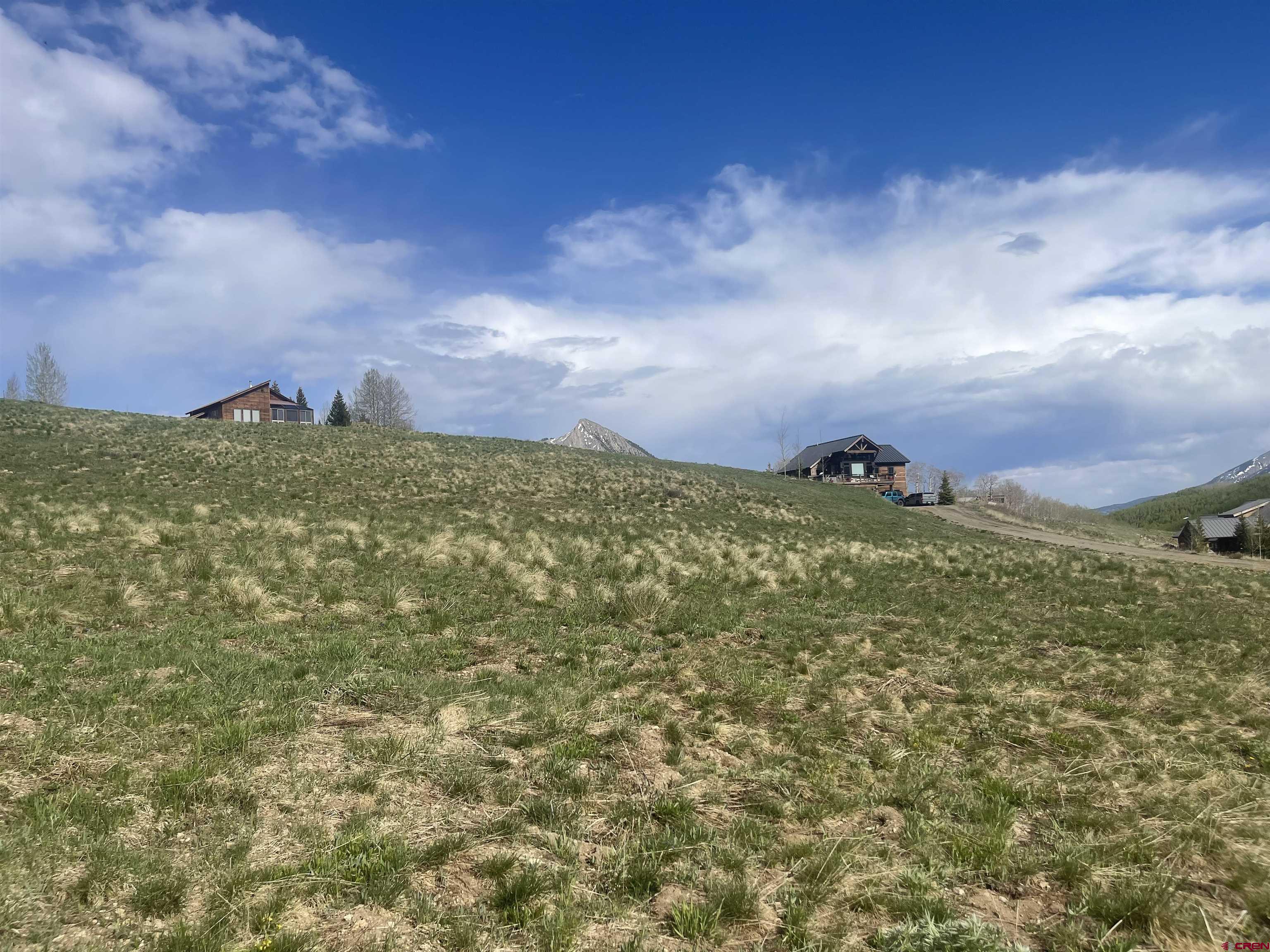 116 Meadow Drive Crested Butte, CO 81224 - Photo 16 of 20 a view of a building in the middle of a field