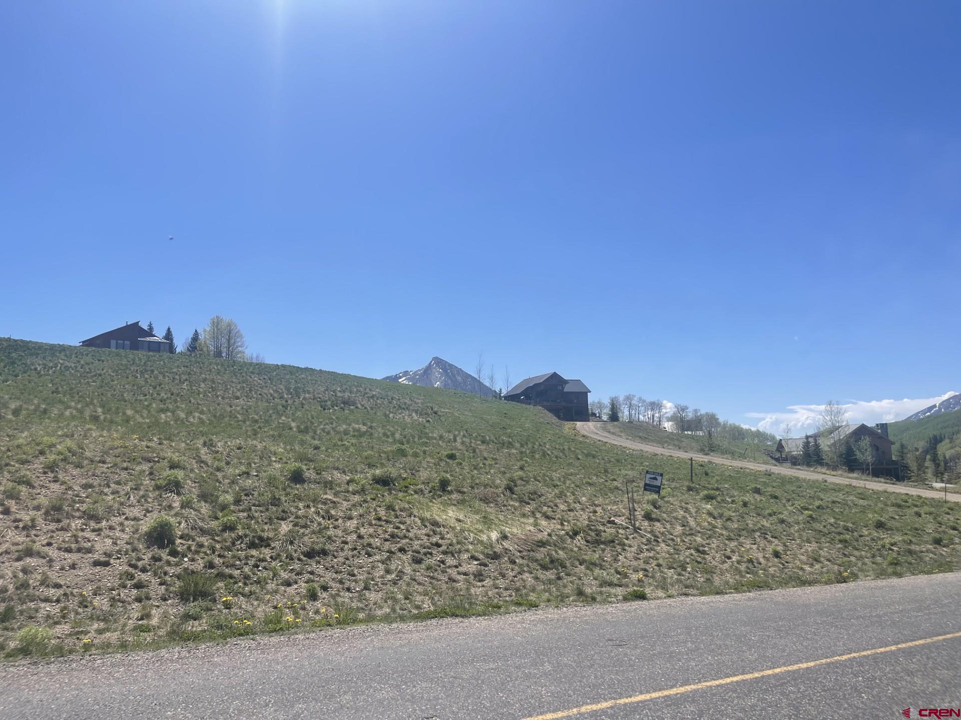 116 Meadow Drive Crested Butte, CO 81224 - Photo 2 of 20 a view of a mountain range with a mountain in the background