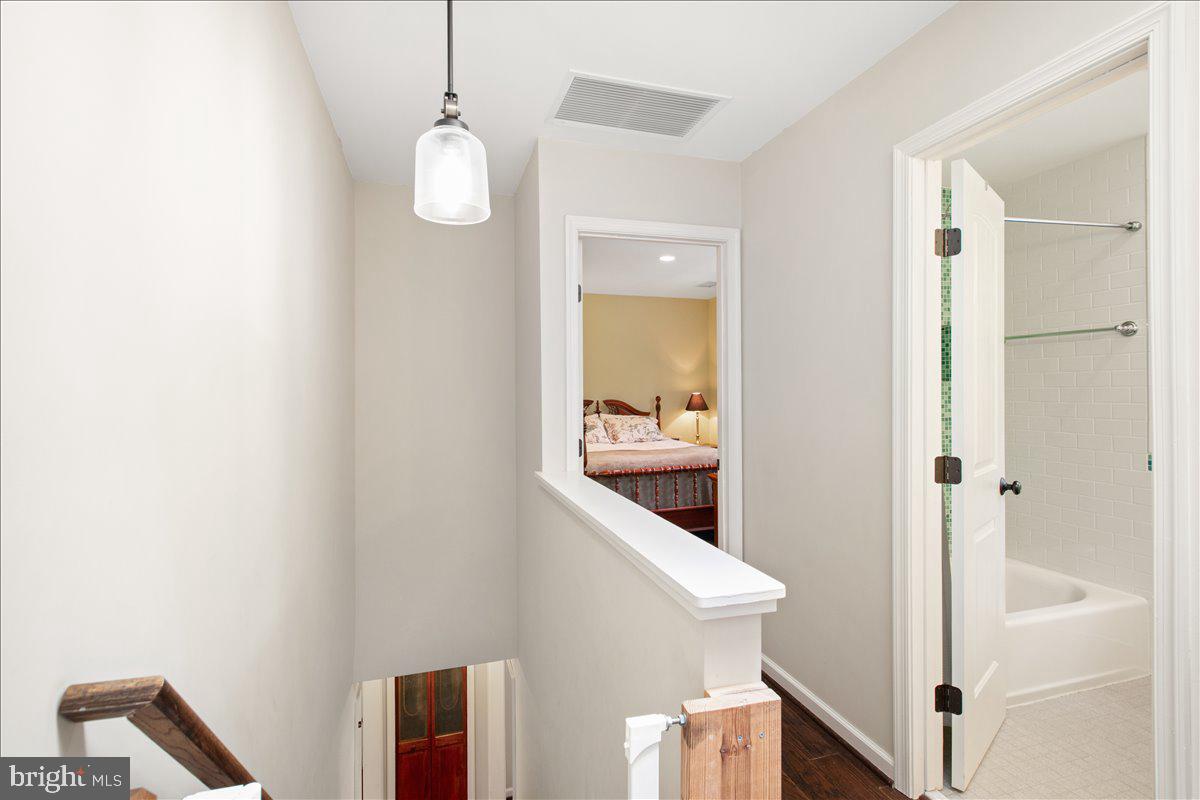 19266 Mockingbird Heights Road Triangle, VA 22172 - Photo 23 of 35 a view of a hallway with wooden floor and staircase