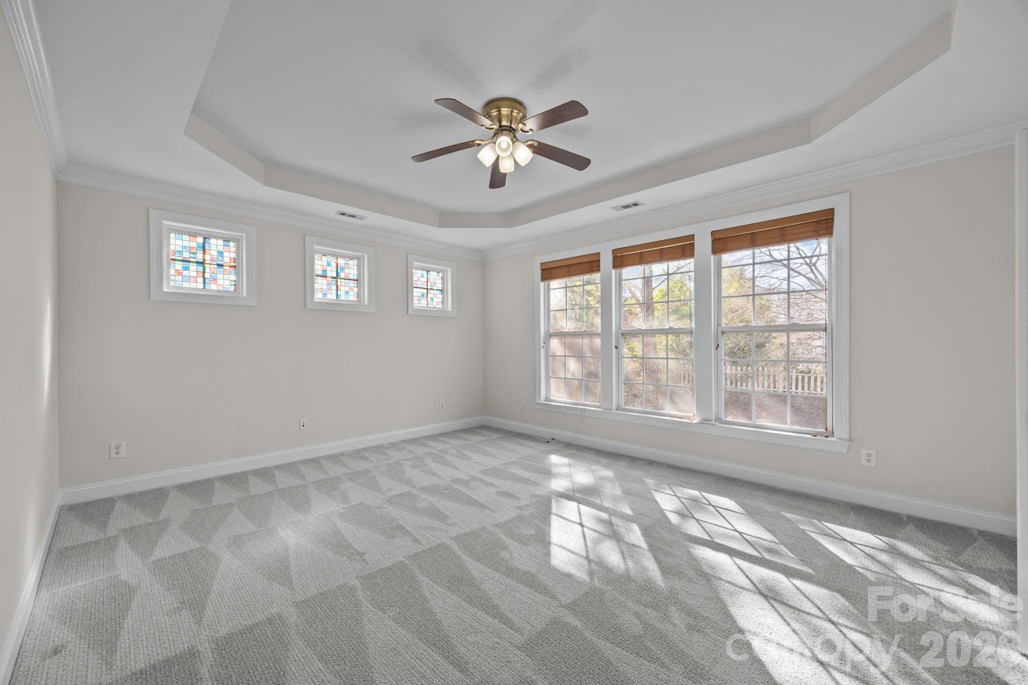 9429 Ridgeforest Drive Charlotte, NC 28277 - Photo 19 of 35 a view of empty room with wooden floor and fan