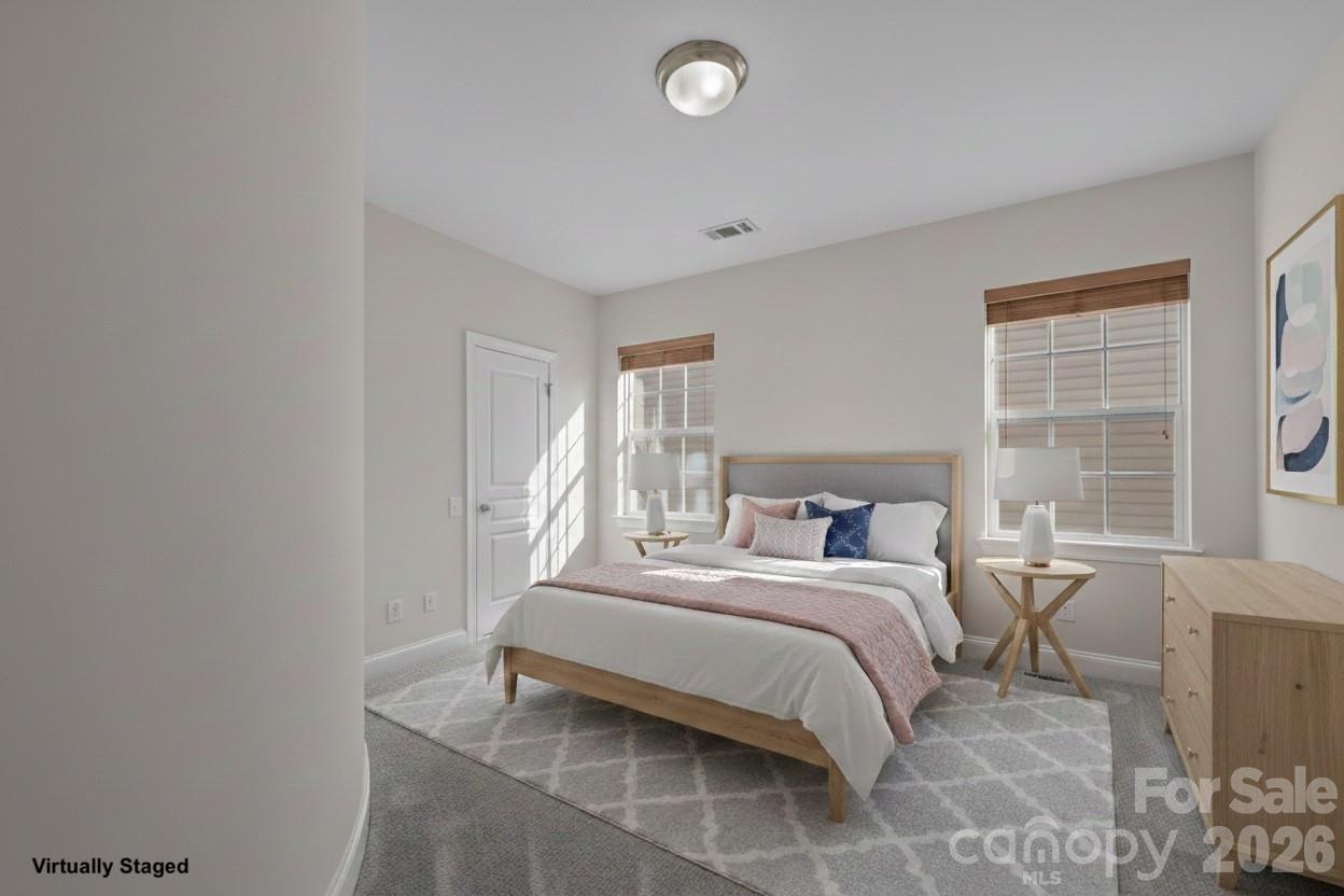 9429 Ridgeforest Drive Charlotte, NC 28277 - Photo 22 of 35 a bedroom with a bed and a window